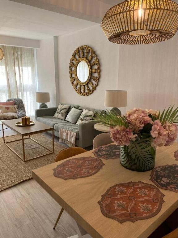 Exceptional Three-Bedroom Apartment Living Room near Playa Victoria, Cadiz - Modern Elegance and Comfort in a Prime Location for an Unforgettable Coastal Living Experience.