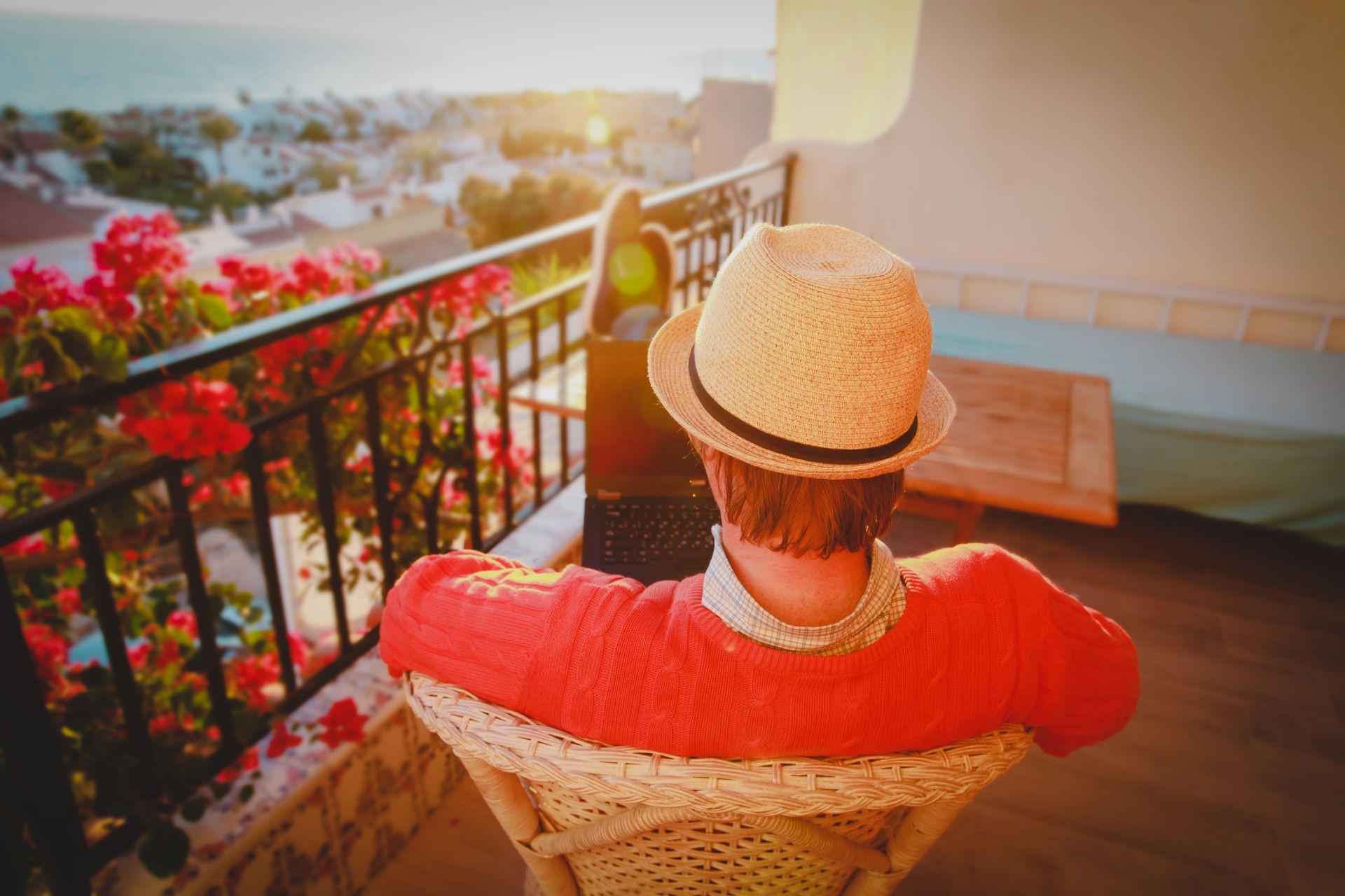 remote work concept- young man with laptop on scenic terrace